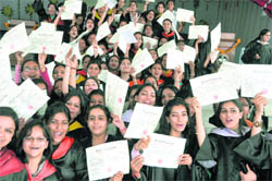 Students of the Khalsa College for Women in a cheerful mood after receiving degrees during the annual convocation in Ludhiana on Saturday.