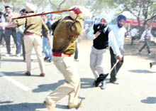 Protesting sikhya karmis are lathicharged by the police while they were on their way to Badal village on Saturday.