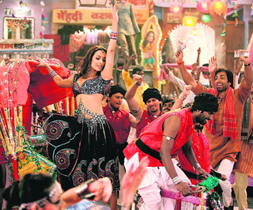 A flower-printed skirt, tights and jewel-studded blouse added to Malaika Aroras sensuality in Dabangg