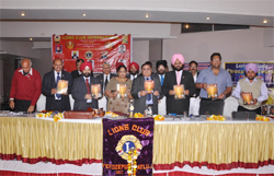 Lion KS Sethi, District Governor and other members release the souvenir on Roshan-2011 at Ferozepur.