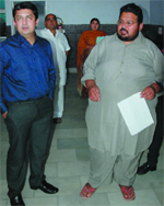 Pawan Kumar (28) from Malout, who weighed 269 kg and has lost 69 kg weight after undergoing bariatric surgery over three months ago, is seen with his doctor at an obesity check-up camp, in Bathinda on Sunday