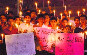 Students take out a candle march to express solidarity with earthquake and tsunami victims in Japan, at Panjab University in Chandigarh
