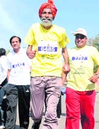 AGE NO BAR: Dharam Pal Gudha of Meerut, who claims to be 113 years old take part in the marathon
