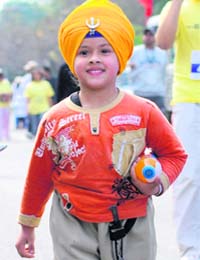 AGE NO BAR: Five-year-old Harjot Kaur take part in the marathon