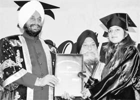 A student receives a degree from Lieut-Governor of Puducherry Dr Iqbal Singh during the annual convocation of Sri Guru Harkrishan Public College of Education at Patiala