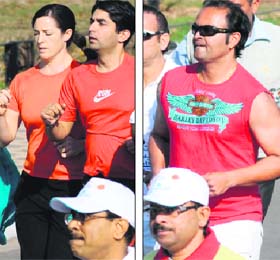 Farsighted: Olympic medallist Abhinav Bindra, along with his physiotherapist Clandia Lepeva; and (right) former Indian cricketer Dinesh Mongia take part in the Chandigarh Marathon