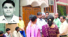Family members of class X student Yash Gupta (inset) of Cambridge School in Srinivaspuri, who was stabbed to death on Saturday evening, in New Delhi 