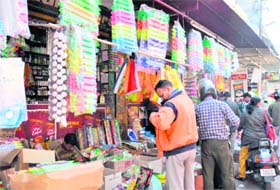 Residents buy Holi colours and other products in Dehradun