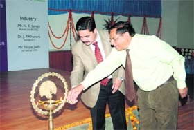 Dignitaries light the traditional lamp at the inauguration of a national workshop at Balawala, near Dehradun