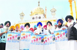 Members of the Dal Khalsa release the original Nanakshahi Calendar in front of Akal Takht in Amritsar