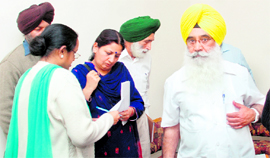 Punjab Education Minister Sewa Singh Sekhwan (right) at Sant Isher School, Sector 70, Mohali. The minister conducted a surprise check at the school, where students were found copying.