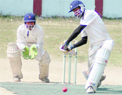 A batsman in action at the Dehradun District Cricket League Tournament at the Survey of India stadium in Dehradun on Monday.