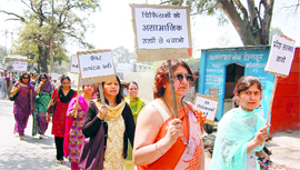 Private and government doctors hold a protest in Dehradun on Monday.