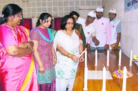 ADC Pankaj Chaudhary lights candles in memory of missing daughters at a Janani Shakti Samman Samaroh at Sirsa