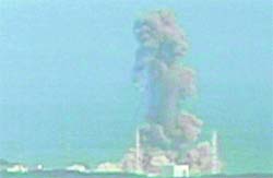 Smoke billows out from the Fukushima nuclear plant's Unit III.