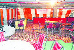 Empty chairs at the auction of two prime pockets of commercial land conducted by GLADA in Ludhiana