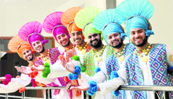 Members of a bhangra team belonging to GNIMT in Mandi Gobindgarh break into smiles as they pose for a photograph during the Youth Festival on the Gujarkhan campus in Model Town, Ludhiana