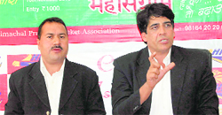 Col. Arvinder (R), chief operating officer of Kings XI Punjab team, addressing a press conference at HPCA stadium in Dharamshala on Monday.