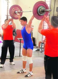 State-level weightlifter Gaurav attempts a lift during the 22nd Men Chandigarh State Weightlifting Championship at Sports Complex, Sector 42