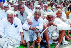 Members of the Jat community stage a dharna, demanding reservation in jobs at Jantar Mantar in New Delhi on Tuesday.