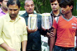 Two persons arrested with fake currency at the Police Headquarters in New Delhi on Tuesday.