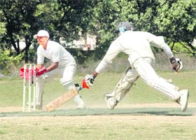 A batsman rushes to regain his crease in a match of the Uttarakhand Cup Beehive Challenger League at Matawala Bagh in Dehradun
