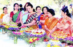 Judges inspect bouquets at an exhibition-cum-award ceremony at the BHEL Ladies Club premises in Haridwar on Tuesday. 