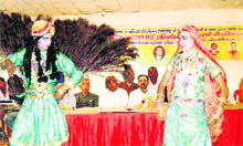 Artistes perform Raslila at the All-India Bijnore Mahasabha Holi milan function in Haridwar on Tuesday. 