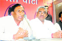 State BJP president Bishan Singh Chufal addresses a press conference in Dehradun on Tuesday.