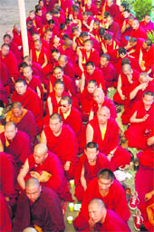 Tibetan monks listen to the teachings of the Dalai Lama in McLeodganj on Tuesday. 