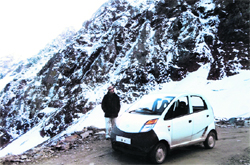 Navneet Chowfla poses with his Tata Nano on the Saach Pass at an altitude of 4413 mt