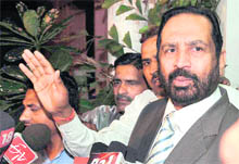 Commonwealth Games Organising Committee chairman Suresh Kalmadi talks to the media in New Delhi on Tuesday.