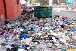 Garbage has piled up in the city due to the strike by sweepers posing health hazards to the people.
