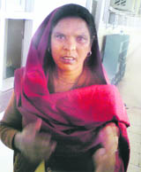 Kamlesh, a resident of Ladwa in Haryana, after being told at the PGI that the surgery of her son has been postponed.