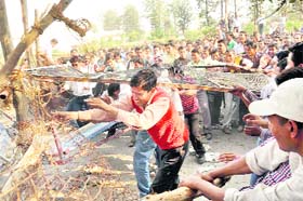 Shiksha Mittars break the police barricade  near the state Assembly in Dehradun