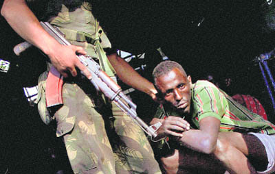 One of the 61 pirates arrested by the Navy being taken to the Yellow Gate police station in Mumbai on Wednesday.