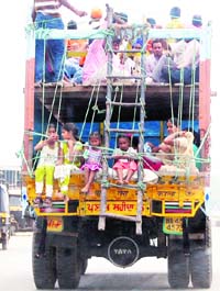 IGNORING SAFETY: Devotees from Amritsar on the way to Anandpur Sahib in a truck for the Hola Mohalla celebrations on Wednesday. 