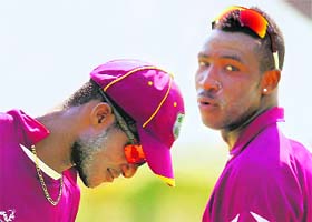 West Indies captain Darren Sammy (L) alongwith a teammate during a practice session in Chennai
