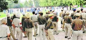 Youth Congress workers at the PGI amid heavy police posse after nine of them were admitted to the emergency ward following a cane-charge in Chandigarh on Thursday.