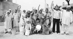 Residents of Pandwala village in Dera Bassi protest against the shortage of drinking water on Thursday.