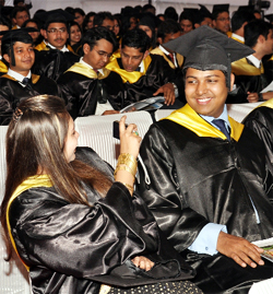 A student clicks a photograph during a convocation function at MDI in Gurgaon on Thursday.