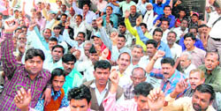 Employees of the Ganga Pollution Control Board hold a protest in Haridwar on Thursday. 