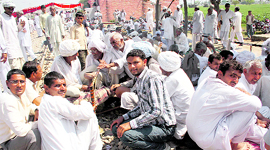 Jats block the Hisar-Rewari rail track at Mayyar village in Hisar on Thursday.