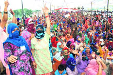Protesters block a rail track at Ramayan village, near Hisar.