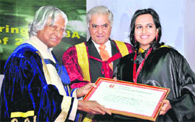 Former president Dr APJ Abdul Kalam gives a degree to a student during the convocation of IMT University in Gurgaon.