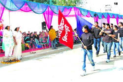 ADC Pankaj Chaudhary and Principal Vijaya Tomar take the salute at the march past during the annual athletics meet in CMK National PG College, Sirsa.