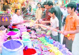 With Holi round the corner, boys purchase water guns and gulal in Jalandhar.
