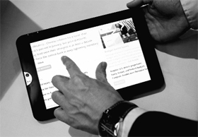 A man navigates a web page on a new Toshibas generation tablet  powered by Android at the GSMA Mobile World Congress in Barcelona on February 15, 2011.