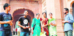 Students discuss the issue of conversion of Khalsa College into a private university, in Amritsar.