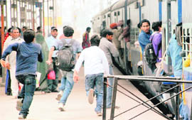 With the festival round the corner, the rush of homeward-bound passengers has increased. Passengers are seen running to catch the Unchahar Express bound for Allahabad in Uttar Pradesh, at the Chandigarh railway station on Friday
